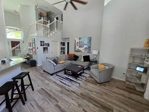 Sectional sofa, swivel chair, coffee table and large artwork