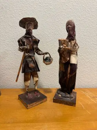 vintage Mexican folk art sculptures of a farmer and a peasant woman