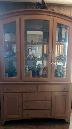 Really nice solid wood with glass doors and shelves  for sell