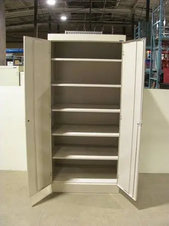 Beige two door metal storage cabinet, has five shelves 36 x 24 x 78