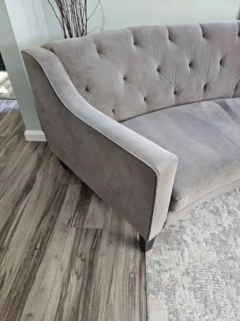Curved light gray/brownish sofa