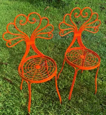 A pair of heavy duty steel garden chairs, newly painted