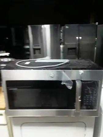 Scratch-n- dent GE stainless steel microwave. In great condition.