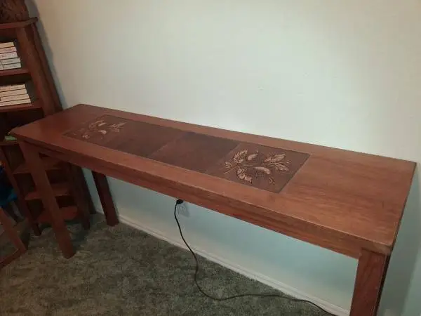 Under Window Entry Behind Couch Table