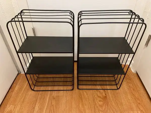 TWO BLACK METAL SHELVES