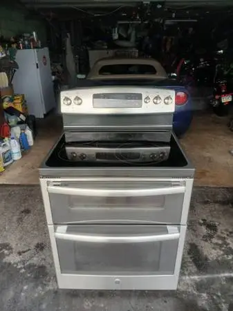 G e top of the line , stainless steel glass , top stove , double ovens like new