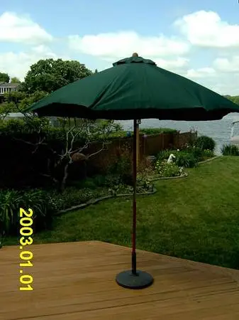 Outdoor Umbrella with Folding Lounge Chairs