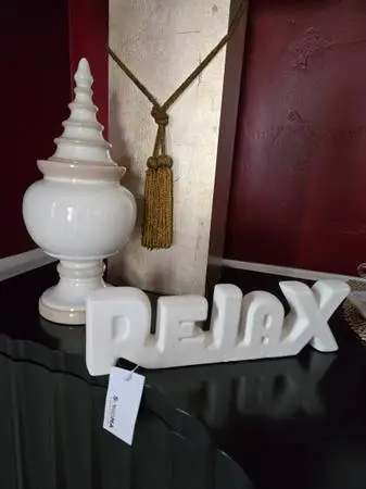 White Vase with Relax sign