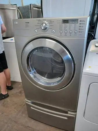 LG Silver Front Load Electric Dryer On Pedestal