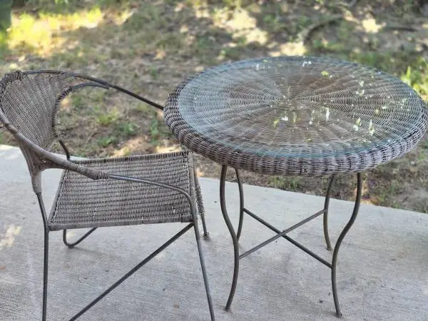 wrought iron round table, wicker, glass tabletop, matching chair, used