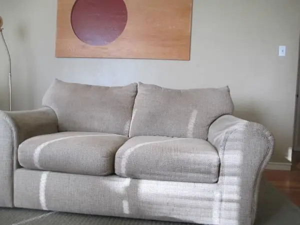 Loveseat for sale, decent shape, no stains, heavy wood shelf on back