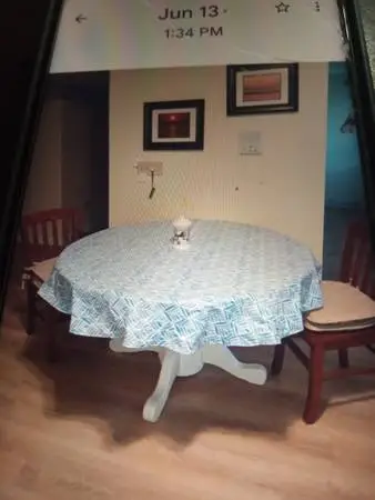 48 inch round table with 2 chairs, place mats and table cloth