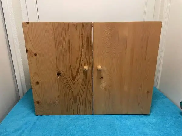 18 3/4 TALL, by 23 5/8 WIDE, by 11 5/8 DEEP WOODEN CABINET
