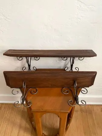 Rustic Wooden Floating Shelves With Ornate Metal Brackets