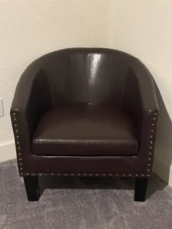 A riveted leather country chair