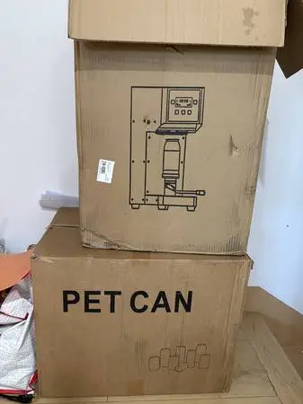 CAN SEALING MACHINE AND CANS