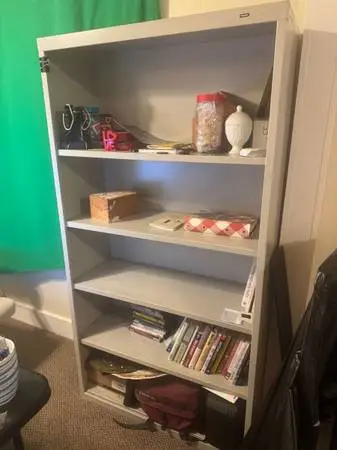 Metal bookshelf built by Tennsco.  Very sturdy.