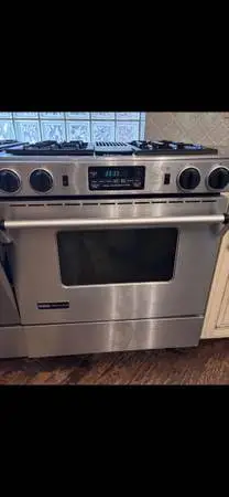 2 Jenn Air Gas Side by Side Stoves