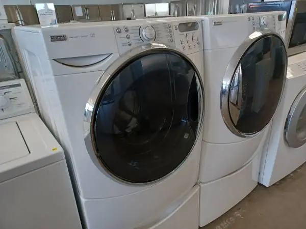 Kenmore White Front Load Washer/Electric Dryer Set On Pedestals
