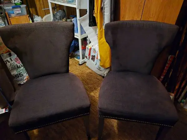 2 cowprint stationary chairs