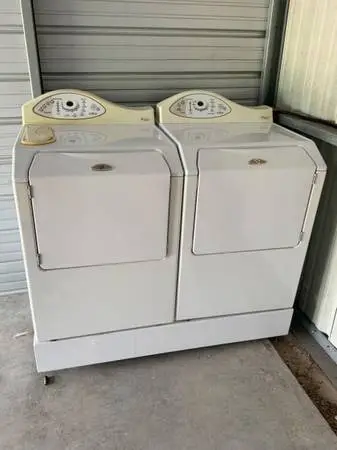 MAYTAG NEPTUNE WASHER, DRYER, AND RISER SET. PLUS AN ADDITIONAL DRYER