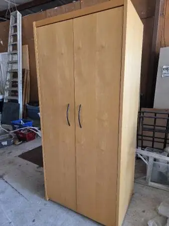 Very nice wardrobe closet. 35x25. By 77 inch tall Comes with two extra