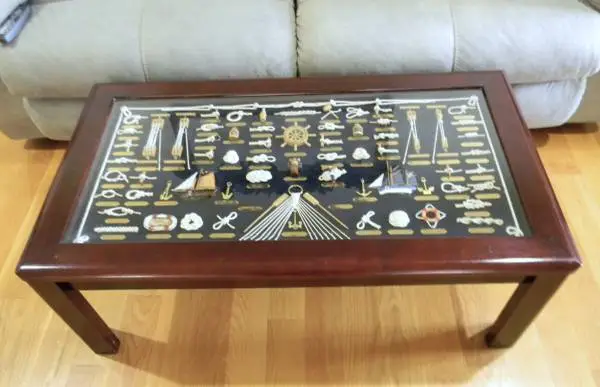 COFFEE TABLE WITH NAUTICAL KNOTS DISPLAYED UNDER GLASS