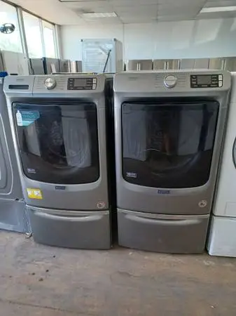 MAYTAG Pro Carbon Washer/Dryer Set on pedestals