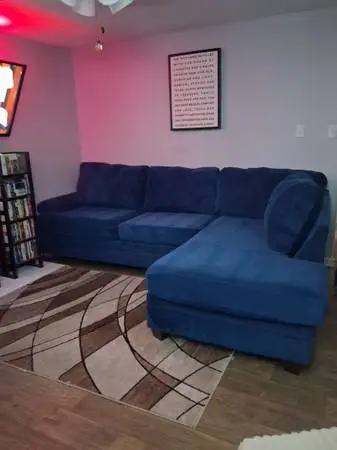 Large blue velvet-style sectional sofa