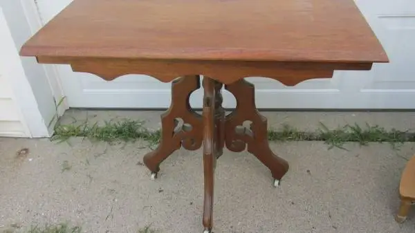 Antique 4 leg 30/ 22wide, 28 tall walnut Eastlake table