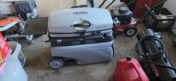 Coleman to go papa grill with cooler on the bottom with sliding. Door