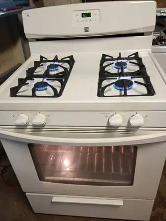 Very Clean off white Gas Stove works Great! Free delivery