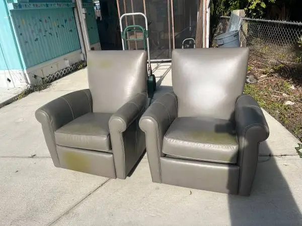 Arhaus gray leather swivel recliner chairs
