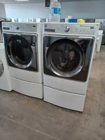 Kenmore White Front Load Washer/Electric Dryer Set pedestals