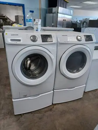 SAMSUNG Smart Washer and dryer set on pedestals