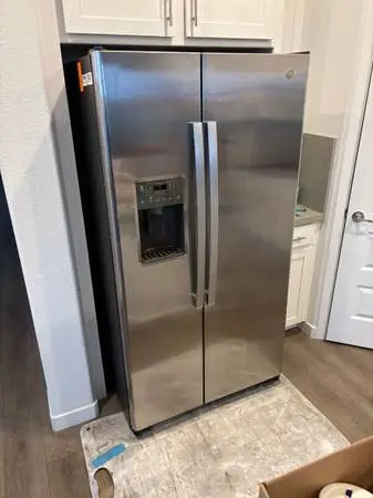 Stainless steel side-by-side refrigerator will deliver and install