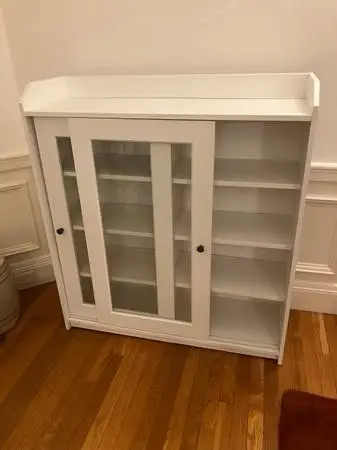 Ikea shelf unit with sliding glass doors