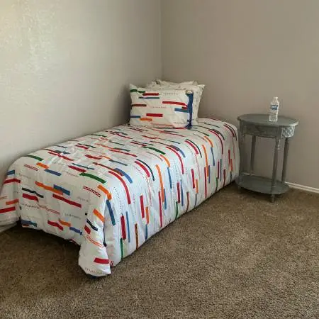 MOVING SALE: Twin bed with linens and nightstand