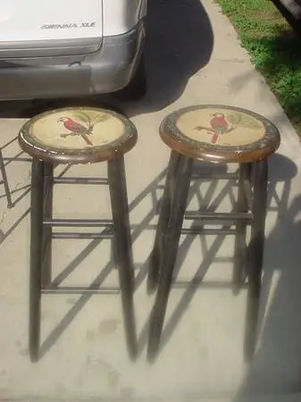 2 barstools with bird painted on seat