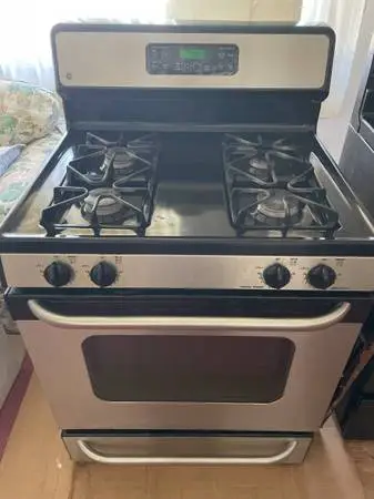 #### GE STAINLESS  BLACK STOVE WITH SELF CLEANING ##