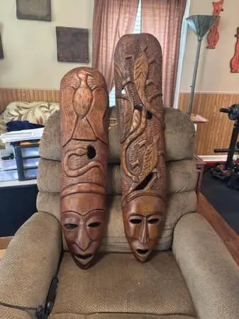 Four unique individual wood carved mask