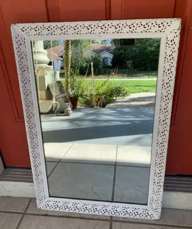 Vintage metal framed mirror Hubbuch Glass Co