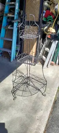 Wrought iron three shelf folding corner stand