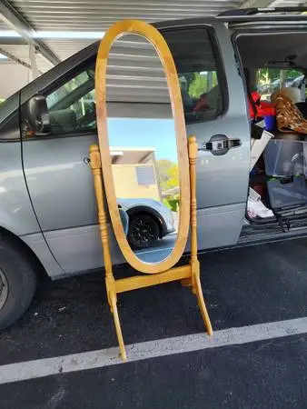 Blonde wood oval standing mirror