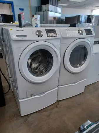 SAMSUNG smart washer and dryer on pedestals