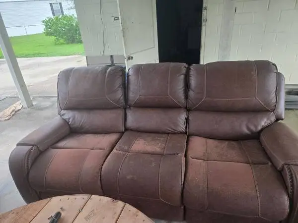 Double reclining couch with middle console and charging deck
