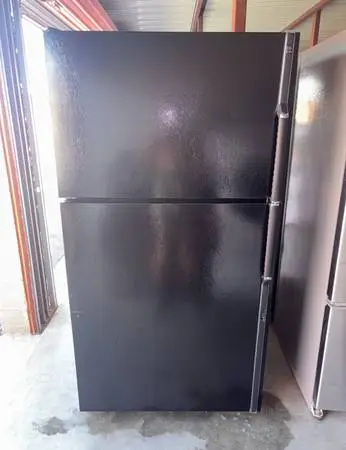 Black GE Refrigerator And Freezer