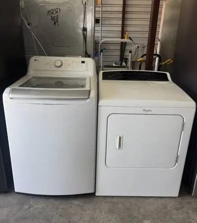 White LG Washer And Whirlpool Electric Dryer