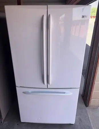 White GE Refrigerator And Freezer