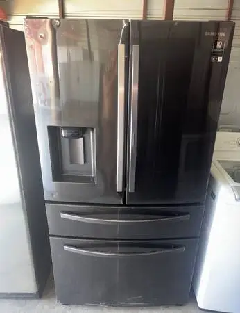 Dark Stainless Steel Samsung Refrigerator And Freezer